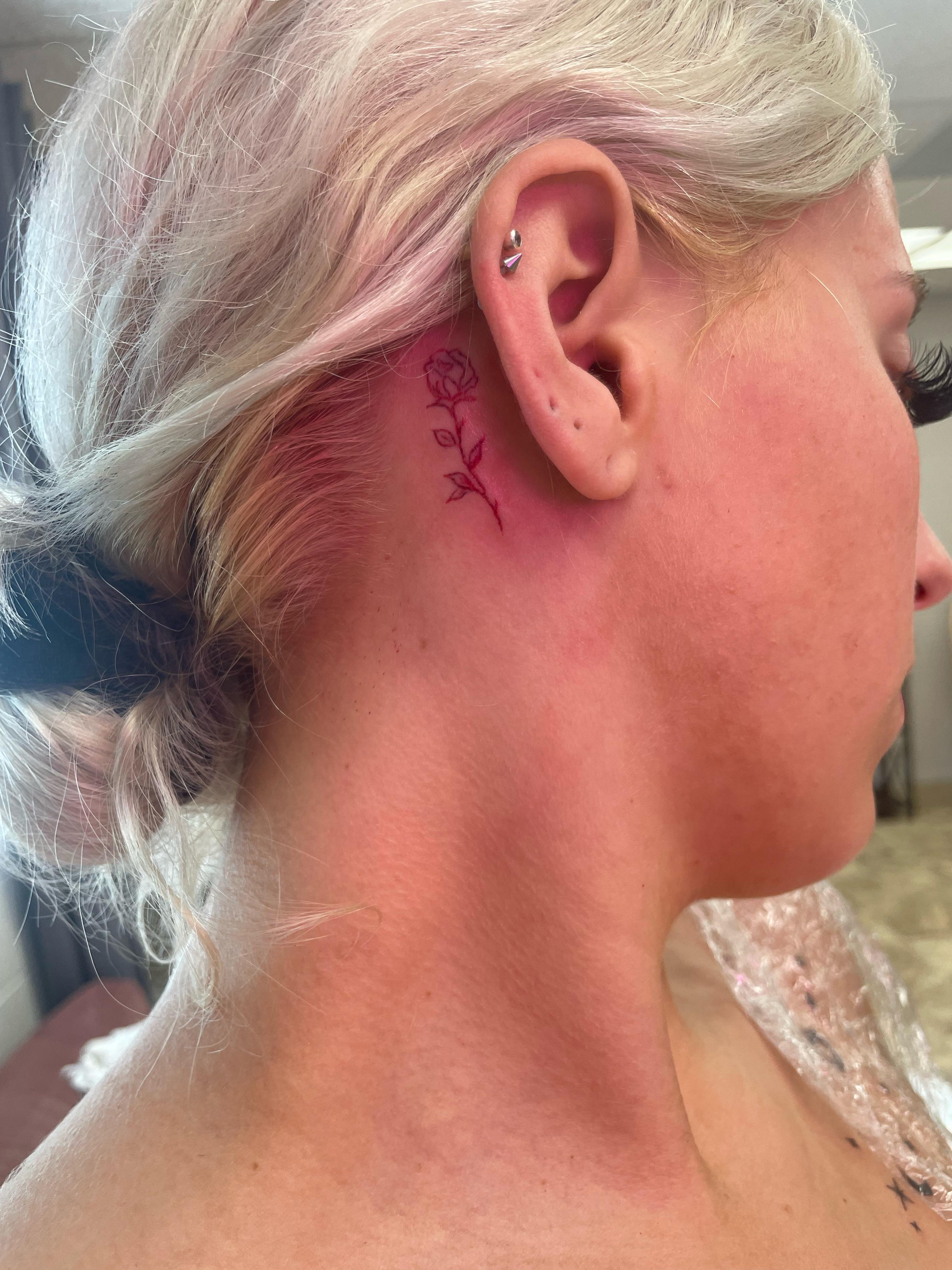 Red Ink Behind Ear: A Bold Statement